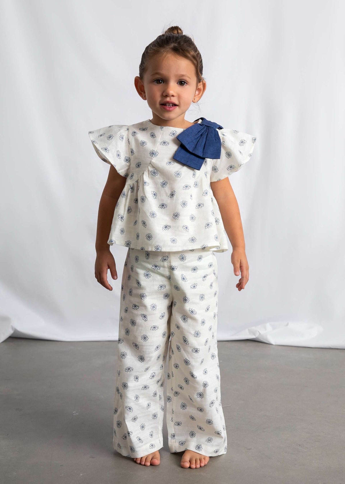 Completo pantalone e top stampato bambina