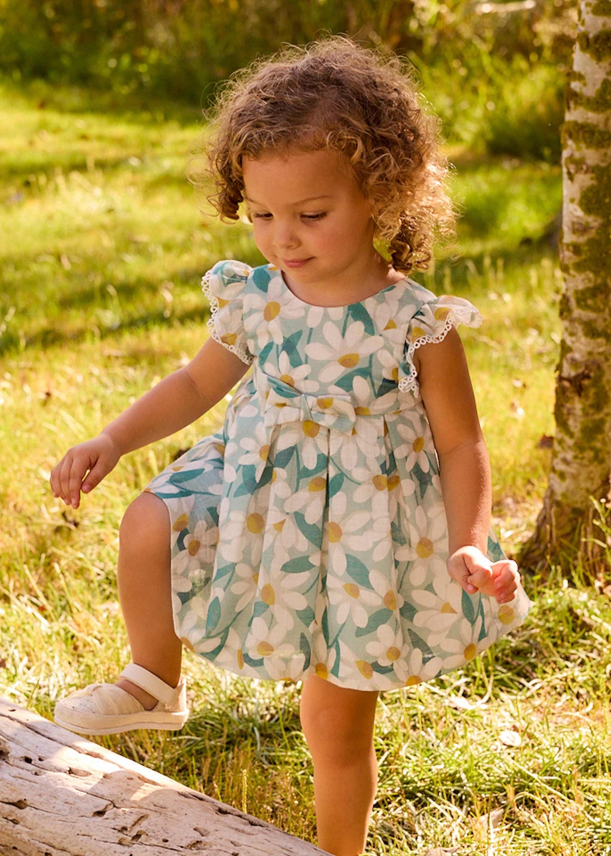 Vestito cerimonia con volant e fiori stampati neonata