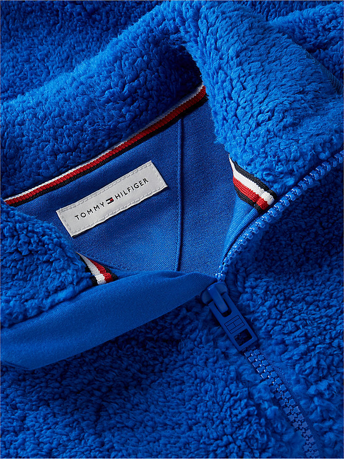 Felpa in pile con zip e bandiera sul retro